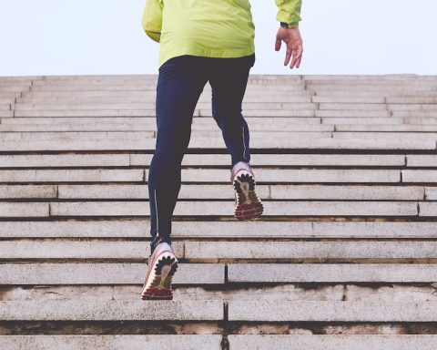 person climbing concrete stairs