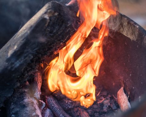 a close up of a fire burning in a pot