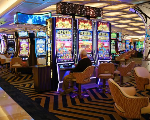 a casino room filled with lots of slot machines