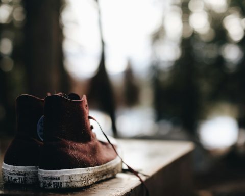 brown leather boots on brown wooden table