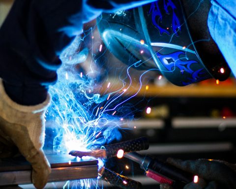 man holding gray steel frame