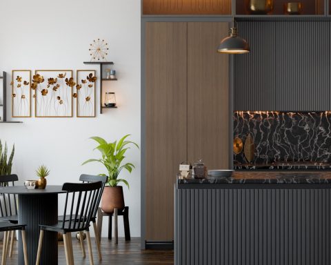 A kitchen and dining room with a table and chairs