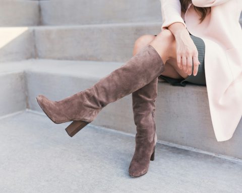woman wearing pair of brown leather boots